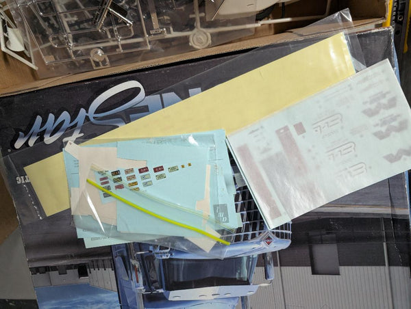 GARAGE SALE   Box of spare parts , decals, tires , wheels etc